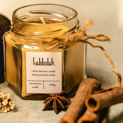 My Cinnamon Oudh candle, captured with the natural spices that inspire its scent. Each one is hand-poured with pure beeswax, offering a clean burn and a warm, inviting fragrance that makes any room feel like a sanctuary.
