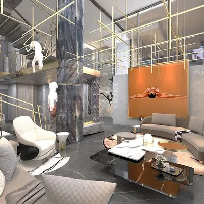 A view of a monumental living space where we balanced scale with comfort. The soaring ceilings are accentuated by custom lighting, while the curved sofa and plush rug define a more intimate seating area within the grander architectural volume.