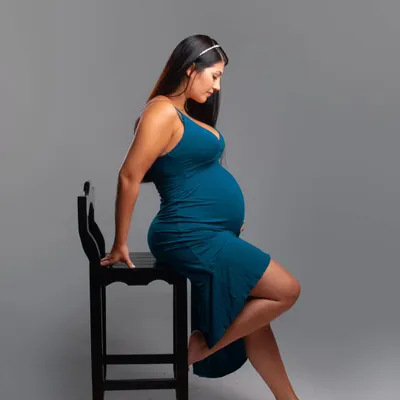 A simple and elegant studio maternity portrait. I focus on creating a comfortable atmosphere where you can celebrate your beautiful baby bump and the incredible journey you are on.