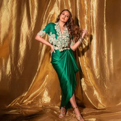 For the 'Heeramandi' promotions, we styled Sonakshi Sinha in this regal green draped ensemble by Anamika Khanna. The look, complete with intricate embroidery and traditional jewelry, was designed to reflect the grandeur of the series.