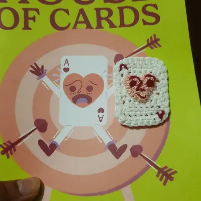 This is a special project that combines two of my passions: illustration and crochet. Pictured is my zine "House of Cards" with a matching micro-crochet piece I created based on the cover art, a perfect example of my handmade gifts.