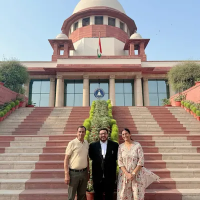Sharing a lighthearted moment with my parents at the Supreme Court. Their support has been a constant throughout my journey.