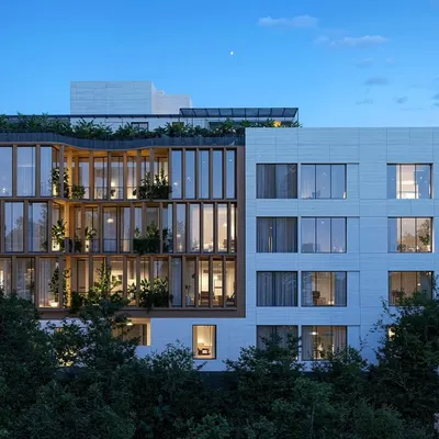Different perspectives of the Amara Avika apartments in Chennai, showing the interplay of the wood-framed public zones and the solid private areas, both during the day and at dusk.
