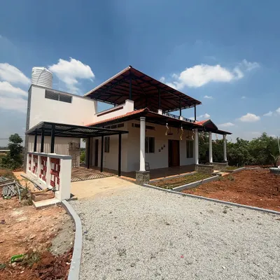 A complete view of a modern villa we constructed, featuring a prominent upper-level terrace and a clean white finish. The design prioritizes open spaces and a strong connection between the indoor and outdoor areas.