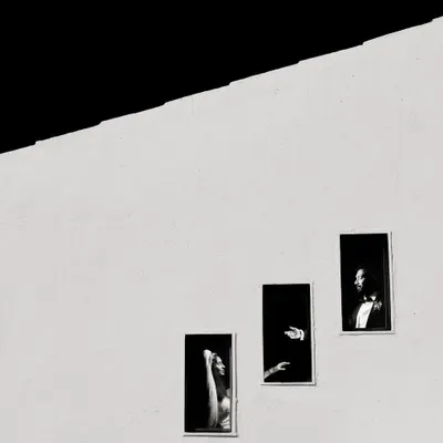 A Fearless Award-winning shot. I used the simple, repeating windows of a building to create this minimalist, high-contrast portrait that tells a story of connection and distance.
