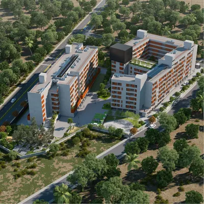 An aerial view of the Mysuru community living project, showing how the two building blocks are arranged to create a protected, vibrant central courtyard. This layout is key to fostering a sense of a shared neighborhood within the development.