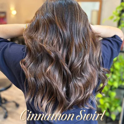 This Cinnamon Swirl is the perfect way to add warmth and dimension to dark hair. The subtle, swirling highlights catch the light beautifully with every movement.