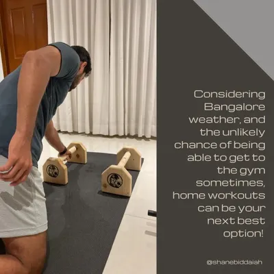 In a city like Bangalore, having a solid home workout plan is a game-changer. Here, I'm using parallettes for a strength session at home. I can equip you with routines that ensure you never miss a workout, no matter the weather or your schedule.
