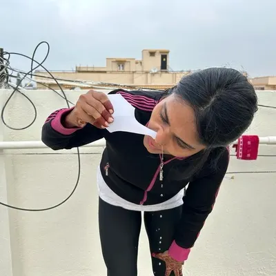 A close-up view of a student practicing Jala Neti. I provide careful instruction on how to perform this nasal cleansing technique safely and effectively for maximum benefits to the respiratory system.