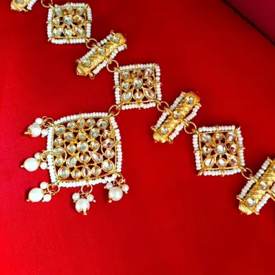 My restocked Sheeshpatti with an attached Mangtika. This all-in-one hair accessory provides a complete and regal look without needing separate pieces.