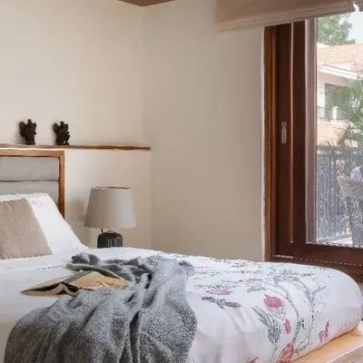 This bedroom showcases my teak live-edge bed, designed to bring natural beauty and comfort together. The simple, clean lines of the frame allow the unique character of the wood to be the main feature.