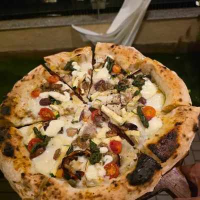 A shot from a fantastic birthday pizza party I catered. There's nothing like serving fresh, hot Neapolitan pies straight from the oven to a happy crowd. I can set up my pizza station indoors or outdoors for any private catering event in the Mumbai area.