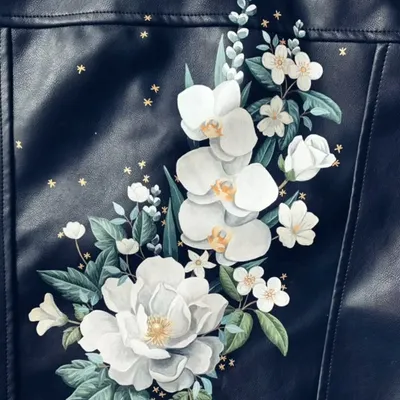 A beautifully hand-painted floral design on a leather jacket, showcasing an exciting way to upcycle your wardrobe.