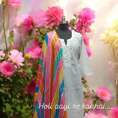 Holi aayi re kanhai! This classic white chikankari kurta paired with a vibrant, multi-colored leheriya dupatta is the perfect look to celebrate the festival of colors.