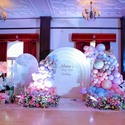 Welcome to a fairy wonderland. For this first birthday, we transformed the space with dreamy pastel balloon clouds, oversized paper flowers, and magical mushroom props, creating an enchanted forest for everyone to explore.