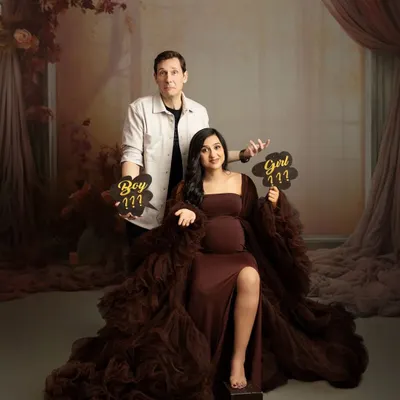 The big question: boy or girl? This fun couple's portrait captures the suspense and excitement before a gender reveal.