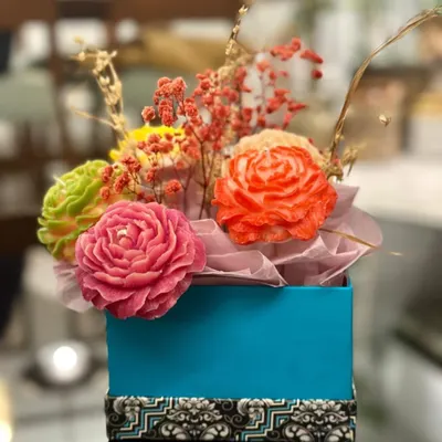 This is my candle flower bouquet, a perfect gift that never wilts! It features a variety of colorful, hand-carved rose candles arranged in a beautiful gift box.