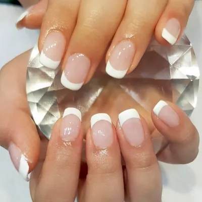 You can never go wrong with a classic French manicure. This clean and simple design uses white tips on a natural base for a polished and sophisticated look.