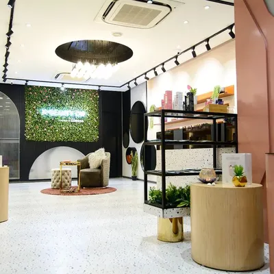 The interior of the Limese skincare store in Delhi, a project we designed and executed. The space features terrazzo floors, soft pink accents, and a living green wall to reflect the brand's fresh and natural identity.