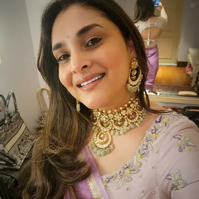 A happy selfie from the Sandalwood Queen, Divya Spandana. Seeing her smile while wearing my creation makes my heart truly full. This image shows the front of her pastel raw silk blouse with delicate spring flower embroidery, which we designed together to match her lilac chiffon saree.