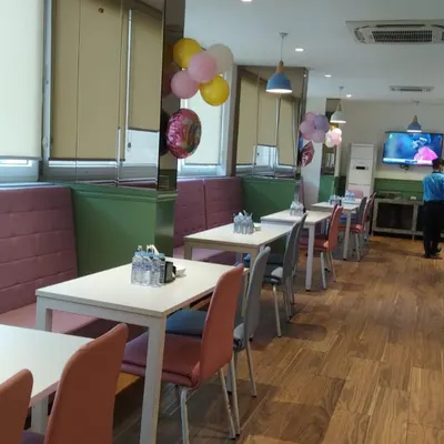 A view of our indoor café area, with comfortable booth seating and tables ready for guests.