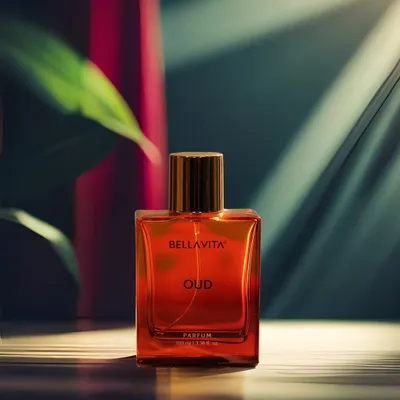 A creative shot of a perfume bottle, using dramatic lighting and shadows to create a sense of luxury and mystery. This style of product photography is perfect for high-end brands and ad campaigns.