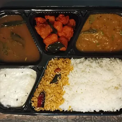 My combo special veg meal, perfect for when you want a bit of everything. This thali has Gunpowder Rice, plain rice, dal, rasam, Aloo 65, and curd rice.