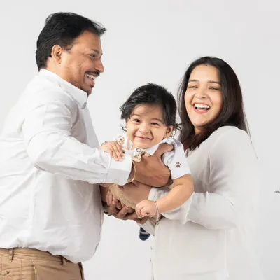 Pure, unrestrained joy! Capturing genuine laughter is my favorite part of photographing families with young children. These moments are truly priceless.