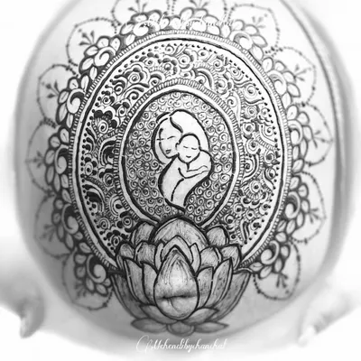 A black and white shot of the mother and child belly henna I created. The monochrome effect highlights the intricate line work and the emotional core of the design.