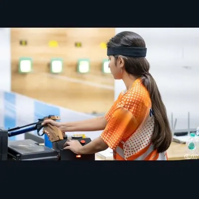 A young pistol shooter hones her technique during a practice session. Our training emphasizes correct form and mental focus from the very beginning.