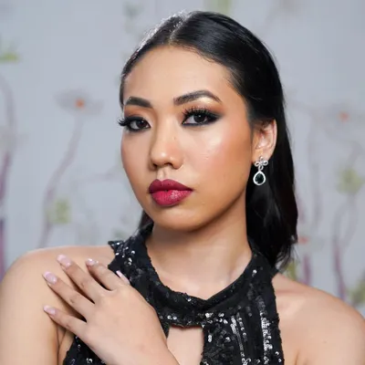 A classic party look featuring a smoky eye and bold lip, perfectly balanced with voluminous lashes. The lashes add just the right amount of drama, making the eyes the main focus.