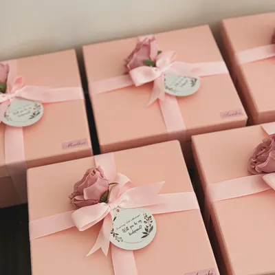 The excitement begins with the box! These pretty pink bridesmaid proposal boxes are all ready to be filled with love and goodies. Each one is personalized with a name sticker and a "Will you be my bridesmaid?" tag.