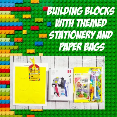 This building blocks hamper includes a small vehicle block set and themed stationery, all packed in a colorful, handmade block-themed paper bag.