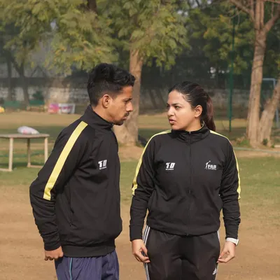 A moment of discussion and strategy between our founder and a fellow coach. At our academy, coaching is a collaborative effort focused on shaping character and nurturing resilience.