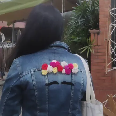 This old denim jacket was just sitting in my closet, but I couldn't let it go. Inspired by one of my favorite artists, Frida Kahlo, I gave it a new story with this crocheted flower hairdo. It’s now a piece of wearable art that is completely, uniquely mine.