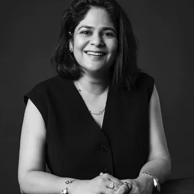 A warm smile and confident posture make for a perfect professional headshot. This classic black and white portrait was taken in my studio, using simple lighting to focus on her expression.