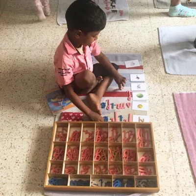 The Moveable Alphabet is where children first experience the magic of writing. They use these wooden letters to build words and sentences, expressing their own thoughts long before their hands are ready to hold a pencil perfectly.