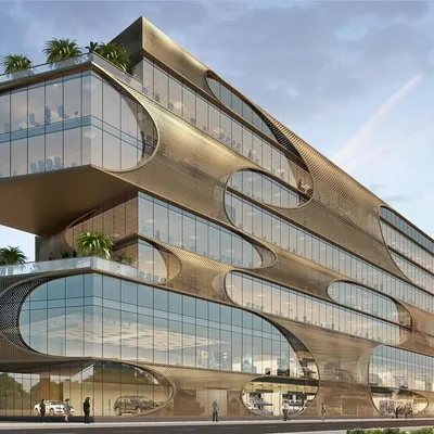This commercial building, designed for Mercedes, features a modern jaali screen that acts as a shading device. The staggered levels are interspersed with interactive green spaces, and the perforated façade creates a unique play of light and shadow.