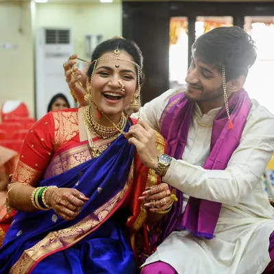 The mangalsutra moment isn't always easy, and that's what makes it real. The pure, uninhibited laughter from Sanika and Shubhankar is what I love about weddings. It's about pure love and fun, not perfection.