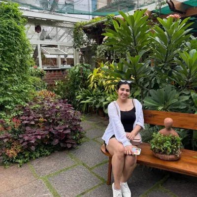 A moment of peace in a beautiful cafe. Finding joy in the small things, like a quiet corner surrounded by green, is a practice in itself.