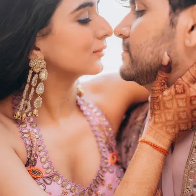 A quiet, intimate close-up of Rupanshi and Yash. This type of shot focuses on the subtle connection and tenderness between a couple.
