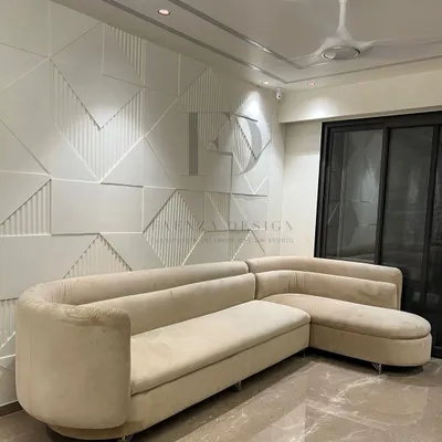This L-shaped sectional in a soft cream fabric offers a clean, modern aesthetic. Its curved corner and chaise lounge provide ample, comfortable seating, making it a perfect fit for contemporary living rooms.