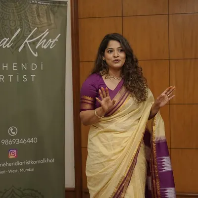 A photo of me during a seminar, sharing my passion for mehendi art with aspiring artists. I love teaching and helping others grow in this beautiful craft.
