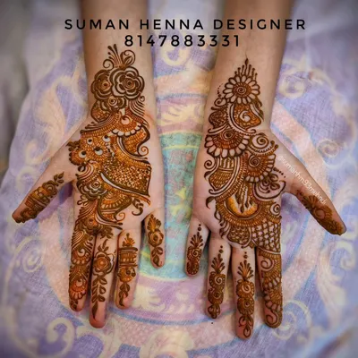 A classic example of an Indo-Arabic design, combining bold Arabic floral vines with finer, detailed fillings typical of Indian henna art.