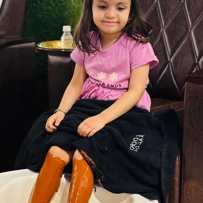 Pampering is for everyone, even our youngest clients. Here's a little one enjoying our special Pedi Café treatment, which uses a gentle, coffee-based formula that smells amazing and leaves skin feeling super soft.