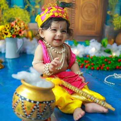 This joyful smile is the essence of a Little Krishna shoot. Dressed in yellow silk with a peacock feather, this baby's happiness is truly divine. It is my absolute favorite kind of magic to create.