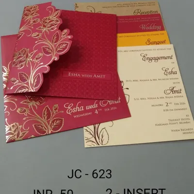 A vibrant red pocket-fold invitation with a gold foil floral design. This affordable card comes with multiple inserts, making it a festive choice for a traditional wedding.
