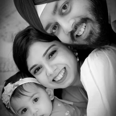 A timeless black and white family portrait that emphasizes pure emotion and connection. This tight embrace shows the beautiful love this family shares.