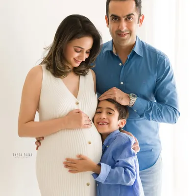 There is nothing more beautiful than a big brother's love. We captured this sweet, unprompted hug during a family maternity session, focusing on the bond that's already forming.