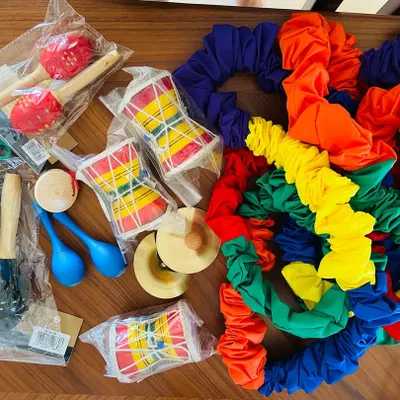 I get so excited when I add new props and instruments for my classes. Here is a peek at some new maracas, drums, and colorful resistance bands, all ready for our next musical adventure.